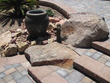 Tech-Noir Landscapes, Inc. Photos This display shows an array of fire pits, water features, and barbeques that add that special touch. Hard scape photo