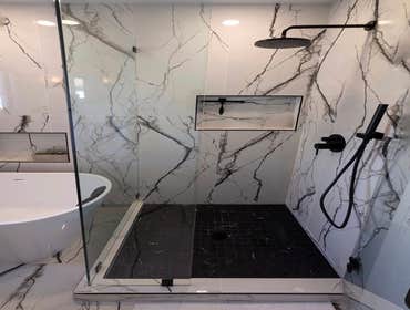 Tub and Shower Porcelain Tile Black Accents