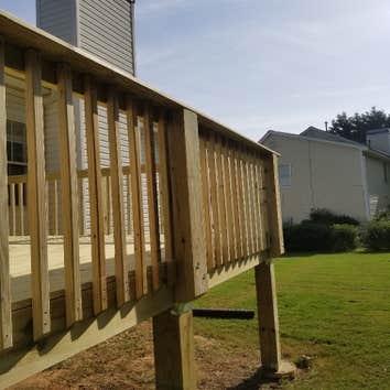 Deck Rebuild demo & haul-off existing deck with the following issues: 1) open risers 2) missing flashing 3) deteriorated handrails 4) loose guardrailin
