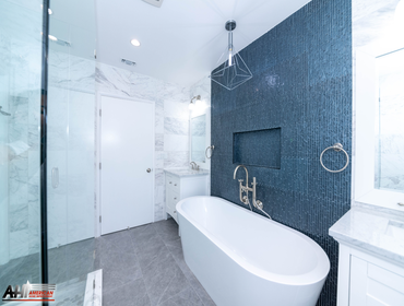 Photos by American Home Improvement #10 Blue & White Master Bath Remodel