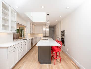 Kitchen remodel We took this home's common areas down to the studs to build a new, open floor plan. In the kitchen, we framed a new vaulted ceiling to 