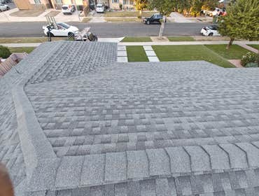Photos by American Array Solar and Roofing #6 GAF Stone Gray shingles for a clean, modern look.
And because we're GAF Golden Pledge certified, our home