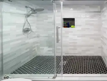 Culver City Bathroom Remodel We transformed this Culver City bathroom into your elegant, modern sanctuary! Imagine a sleek gray double vanity with silv