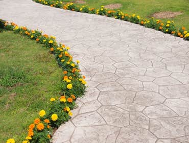 Photos by Stamped Concrete Denver LLC #1 Stamped concrete, often called textured or imprinted concrete, replicates the look of many different stones su