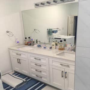 Photos by Ray's Remodeling & Construction #1 Redid cabinets did quartz walk-in shower with double faucet and bench!