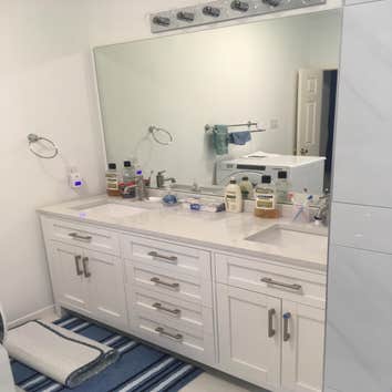 Photos by Ray's Remodeling & Construction #1 Redid cabinets did quartz walk-in shower with double faucet and bench!