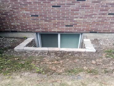 Landscape block window well Landscape block egress window wells. Homeowner got the block and we built the window wells out of it.