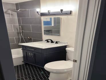 Shower/Tub Grey Tile Blue Vanity