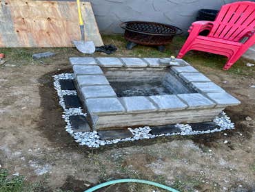 Photos by JAC Building Co LLC #6 Dug put a 6 inch box, poured a concrete foundation. Built the Firepit/Fireplace on top of the foundation.
Time to comp