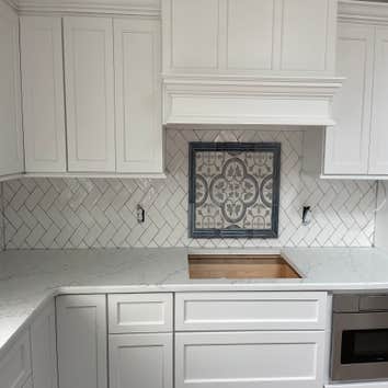 Photos by Smilenow Landscaping LLC #1 In this project, we installed custom backsplash as well as countertop installation.
