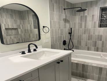 Modern Bathroom Redesign Transformed the bathroom with sleek, contemporary design and premium finishes for a stylish, functional space.