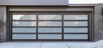 Glendale, CA - New Modern Garage Door One of our amazing projects, beautiful new garage door. Black metal frame with grey glass.