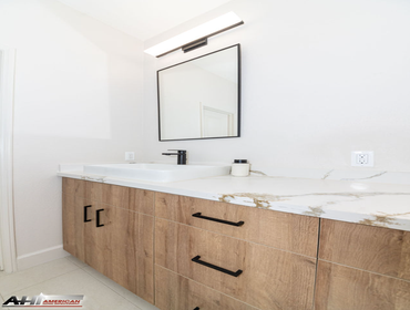 Photos by American Home Improvement #2 Brown & White Modern Bathroom Remodel