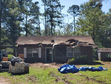 Photos by Service Restoration Pros LLC #1 A tree fell through the roof of this 3 bedroom house during Hurricane Ida. It left several gaping holes and a