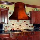 Custom Copper Range Hood hard distressed copper range hood
http://www.texaslightsmith.com/range-hoods/#_36