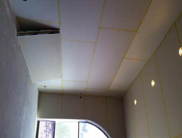 Photo(s) from T And C Drywall This is an apartment main office building.
-Furred out cement walls
-drywall
-texture