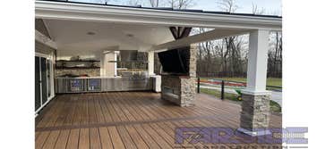 Photos by Farside Construction LLC #1 Newly constructed covered deck with standing seam cathedral style gable roof. Excavated and built a walk out egre
