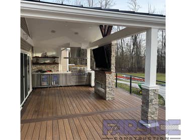 Photos by Farside Construction LLC #1 Newly constructed covered deck with standing seam cathedral style gable roof. Excavated and built a walk out egre