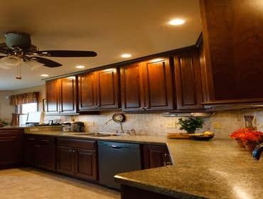 Meadville Two Tone This is a beautiful kitchen with Aurora White Perimeter Cabinets and Two Cherry Islands. All work from design to install of everyth