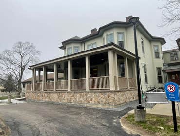 Front Porch Full new front porch built, with handicap ramp, PVC trim column wraps and ceilings.
Pavers on porch and veneer stones walls.
Custom metal