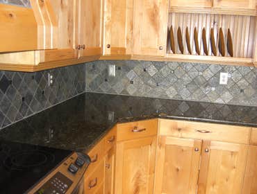 Project photos from Solid Surface Creations - DCI Stone Back Splash with Hood Stone Insert