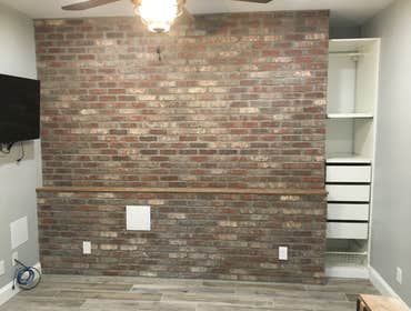 Accent Brick Wall Brick wall to enhance fireplace in Family Room