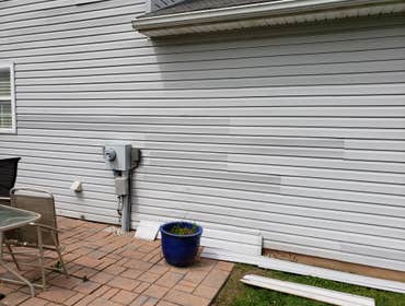 Photos by DJS Home Remodeling, LLC #2 Replaced siding that was melted by a gas grill