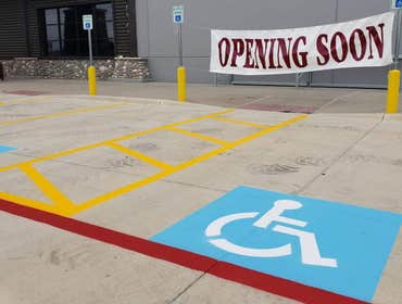 Clean, compliant handicap painting can make a huge difference in your parking lot.