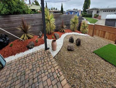 Photos by Landscaping La Economica LLC #1 Installed artificial turf, paver stone walkway, decorative mulch, and a new wooden fence. This project provid