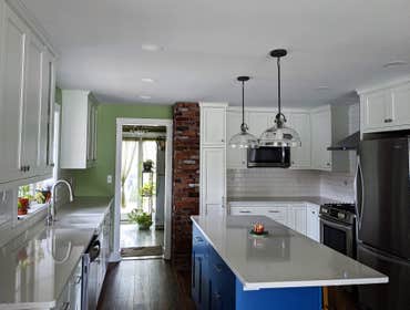 Photos by Embassy Construction LLC #8 This property was built in 1920. The call to action was to create an open floor plan on the first floor for a new
