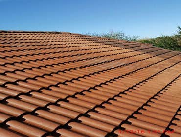 Photos from Popa Construction LLC Before & Afters of a soft wash roof cleaning and driveway and side walk cleaning.
