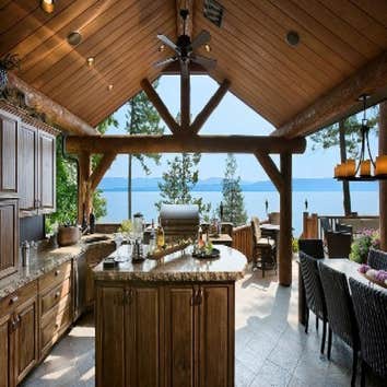 Retreat at Flathead Lake This award winning 5550sf home with 2 guest cabins and a two slip dock on beautiful Flathead Lake in Northwest Montana was des