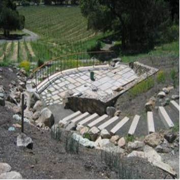 (Sonoma County) Santa Rosa Wine tasting and entertainment terrace construction. Constructed storm water runoff control systems: surface diverter swale