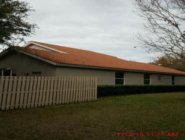 Photos from Popa Construction LLC Before & Afters of a soft wash roof cleaning and driveway and side walk cleaning.