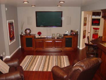Finished Lower Level Complete finished basement. Includes theater room, custom bar & back bar, game area, full bath, steam shower and work out room.