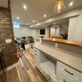 Bachman Dr, POWELL Basement Full basement finish including a kitchenette/wet bar, full bathroom, bedroom w/ egress window, and living area.