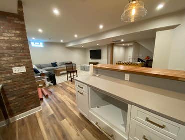 Bachman Dr, POWELL Basement Full basement finish including a kitchenette/wet bar, full bathroom, bedroom w/ egress window, and living area.
