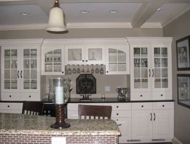 A kitchen/living room remodel in Edina Mn Enamled all cabinets, windows and wood trim. Painted all walls and ceilings.