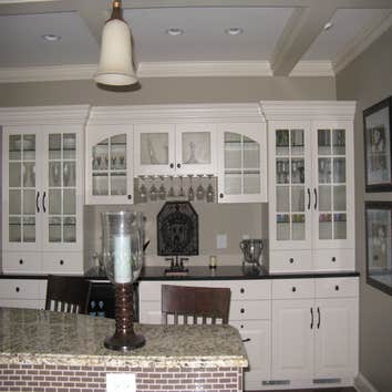 A kitchen/living room remodel in Edina Mn Enamled all cabinets, windows and wood trim. Painted all walls and ceilings.