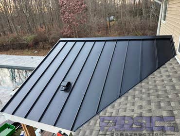 Photos by Farside Construction LLC #1 Newly constructed covered deck with standing seam cathedral style gable roof. Excavated and built a walk out egre