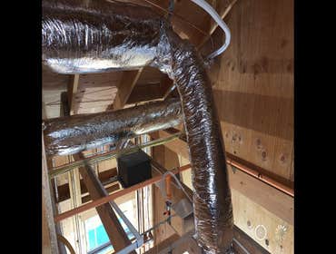 Photos by All Weather Heating and Air Conditioning Two complete HVAC systems including ducting, to be installed in two phases; pictures shown are from 