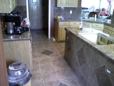 Othello Kitchen Granite/Porcelain Tile Work Kitchen Countertops and Backsplash done in Granite tile with hand beveled and polished edges and floors don