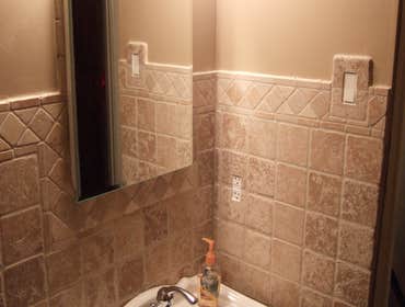 Churilla bathroom A ceramic job for Pittsburgh Police Officer and ceramic is all natural stone with custom detail.