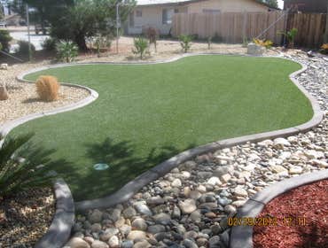 Artificial Turf Installation Before and after pictures for a synthetic turf system.