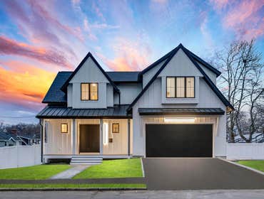 Custom Home Built in Arlington MA Modern James Hardie board and batten design with contemporary windows by Marvin. Other notable features include:
Des