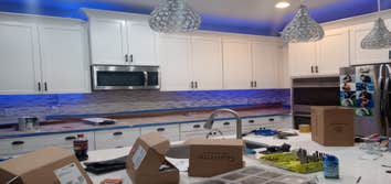 Kitchen cabinet refinish Cabinets went from black to these beautiful cupboards. This project took only a few days and the owner loves it!!