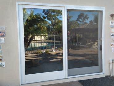 Slider Door Installation Installation of a slider door with trim finish interior and stucco match exterior finish.