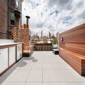 Upper West Side On this project we completely removed the the existing roof, installed a new roofing system, new roof deck pavers, ipe fence, and a Kit