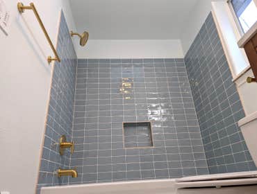 Designer Gold Bathroom Excited to finish our full gut bathroom project! The remodel included brushed gold fixtures, Italian, handmade tile, updated bat