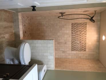 Walk in shower with travertine
